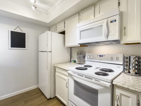 Fully stocked.  Plates, bowls, Keurig, cookware this unit has it all!