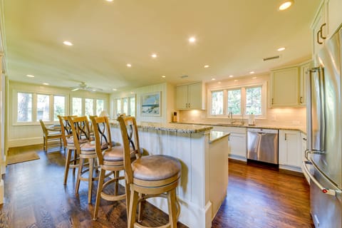 Chef's Kitchen with seating for five at a Breakfast Bar.
The kitchen also includes a Keurig and Drip Coffee Maker.