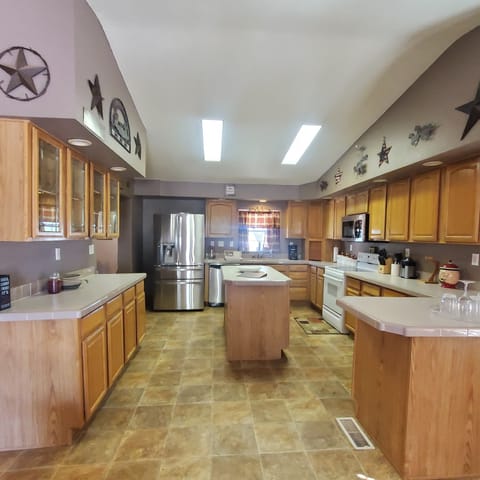 Fully stocked kitchen with island.