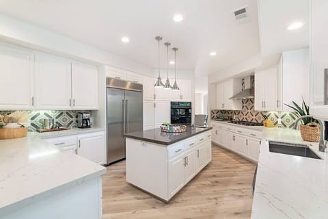 The kitchen is spacious enough for all your friends and family to pitch in with diner or hang out as you cook