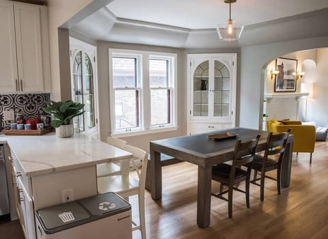 A look at a bit the kitchen and the dining room, going into the living room.