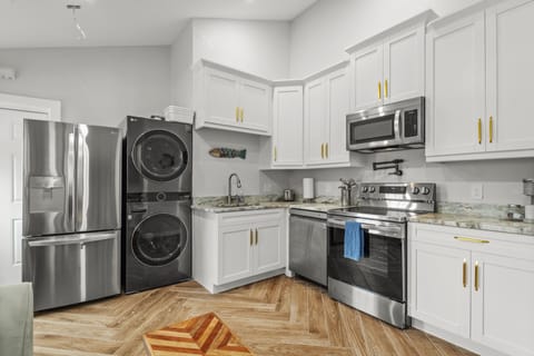 Living room with Smart TV/ Full kitchen with appliances. 