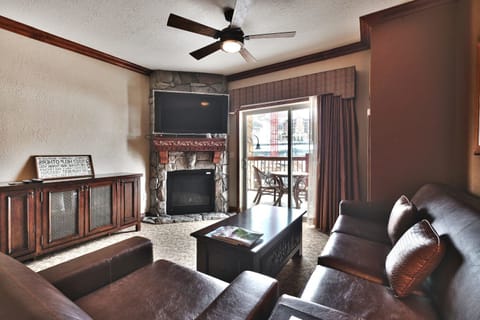- Gather in the living room with leather seating and fireplace  
- Step outside to the balcony for fresh alpine air and views  
- Watch shows on the flat-screen TV in a cozy rustic space