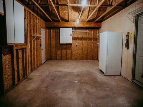 ATTACHED GARAGE PERFECT FOR STORING YOUR SNOW MOBILES, VEHICLE, OR OTHER NORTHWOODS TRAIL TOYS.