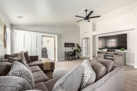 Comfortable living space with ample seating, Smart TV, dedicated work space