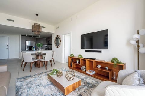 Plenty of natural light in a modern and exclusive open concept decoration of our living dining and kitchen. We have enough space for up to 8 people to have meals comfortably!