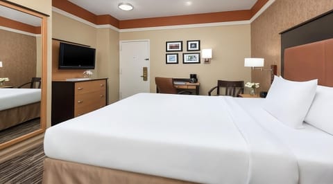 Get productive at the in-room desk, then sink into bed.