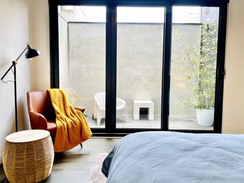 master bed with outdoor courtyard