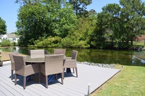 Relax on the back deck overlooking the pond.