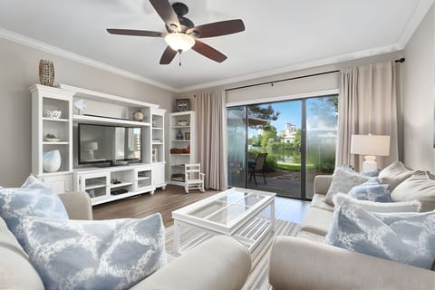 The living room is the perfect place to gather together — whether you’re relaxing with a movie night or stepping out onto the patio to enjoy the fresh air and views.
