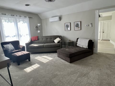 Living room with lots of seating and smart tv