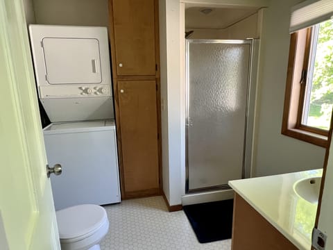 Bathroom with shower and laundry