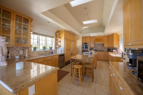 Large kitchen with center island and pantry
