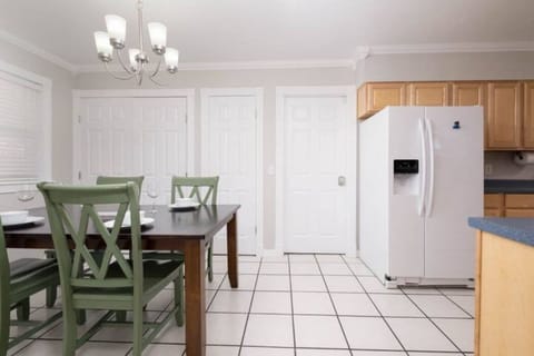 refreshing dining area with access to pantry and  laundry room