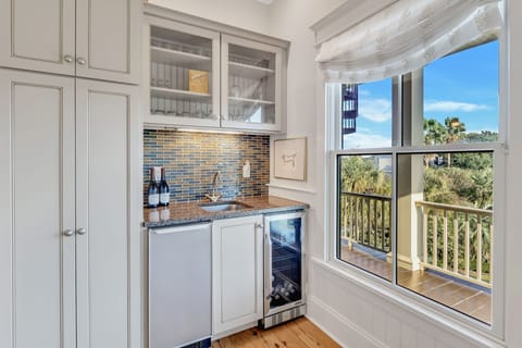 Additional beverage fridge and wet bar.