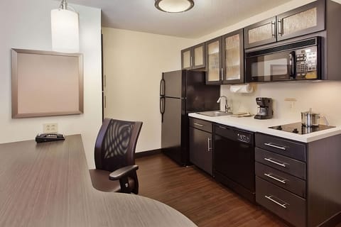 Cook with ease in the modern kitchenette with full appliances.