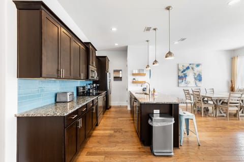 Additional barstool seating at the island counter ensures plenty of room for everyone.