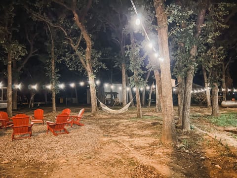 fire pit, hammock under the string lights 