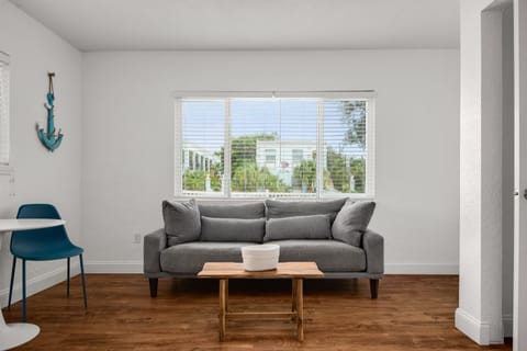 Cozy living room with a table and chairs for dining. 
