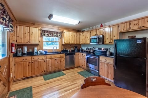 Kitchen - View of kitchen with dining room table.