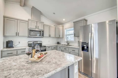 Enjoy a full kitchen and a large center island with your rental during your stay!