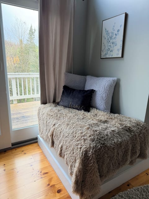 A cozy window seat reading nook