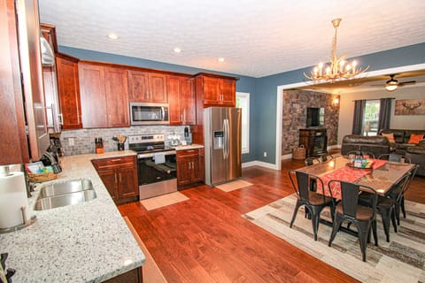 Fully stocked kitchen with granite countertops and stainless steel appliances