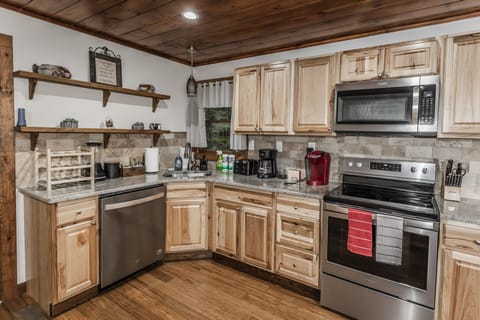 Beautifully decorated kitchen with all utensils needed.