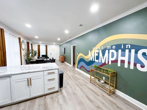 Kitchen and Living Room with a custom designed mural designed by local artist Becka Matthews.