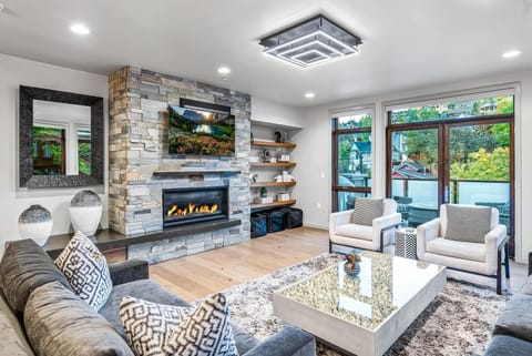 Living area with town/mountain views and walk out balcony, seating, firepit
