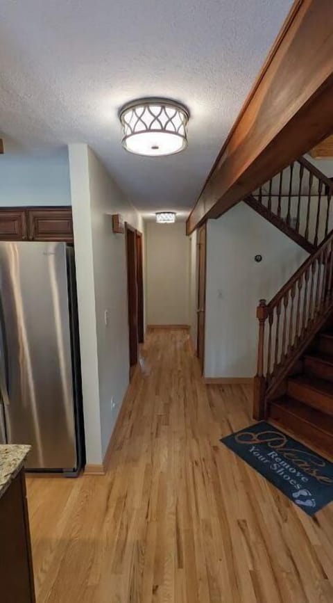 hall leading to downstairs bedroom and laundry room
