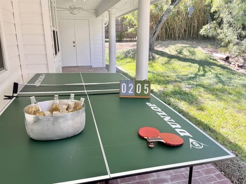 tournment size ping pong table outside of the bunkroom