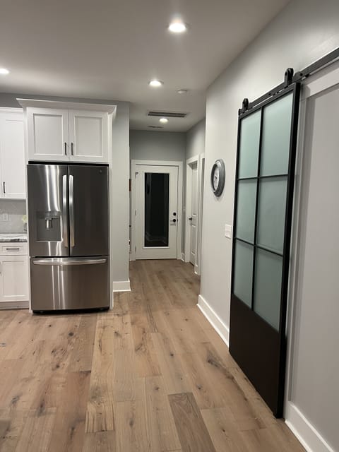 Very stylish doorway to garage and laundry room.