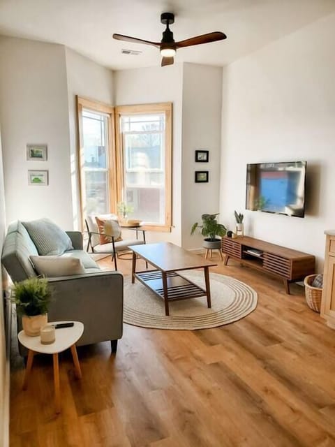 Beautiful living room with fold down couch and smart TV.