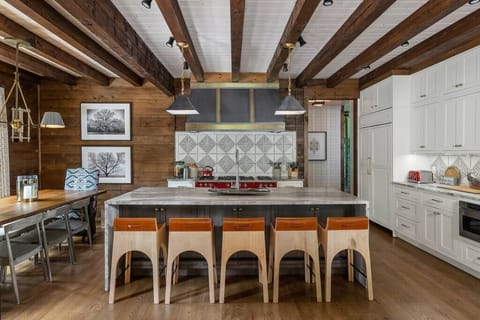 Stylish kitchen with oversized island and dining area.
