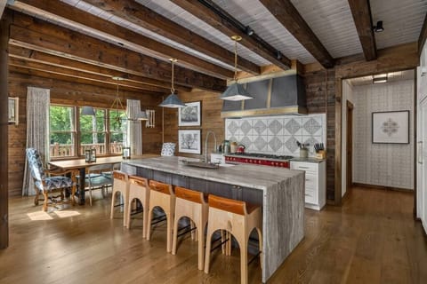 Stylish kitchen with oversized island and dining area.