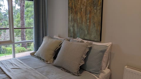 Garden view bedroom with a double bed