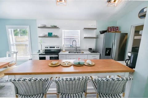 Fully equipped kitchen with full size appliances and sitting for 3