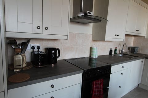 Kitchen is packed with a Refrigerator, Oven, Stove, Dishwasher, Microwave ect