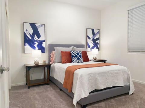 Bedroom with queen bed and stylish, welcoming decor