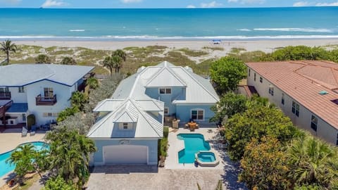 Aerial Showing Home, Pool and Beach