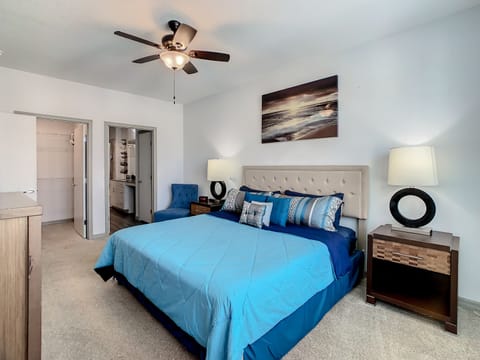 Unwind in Style: Retreat to our expansive bedroom featuring a king-size bed.