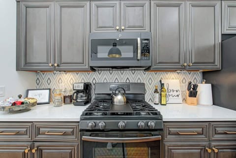 Use clean, new GE appliances to prepare meals for your group.  Large appliances include microwaves, oven range, French door refrigerator, dishwasher, & garbage disposal.  The upstairs kitchen has a gas oven range and the lower level has electric.