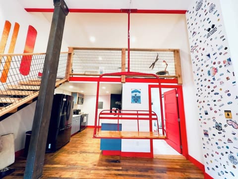 Authentic ski lift chair hanging from the ceiling. Feel free to relax on it.