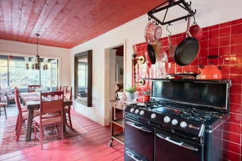 A vintage stove sets the stage for culinary delights in the cozy dining area of Wrightwood Chalet.