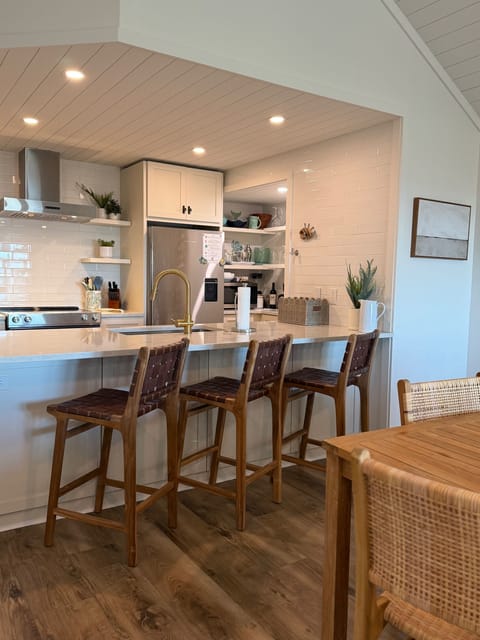Extra seating at the counter with teak & leather bar stools