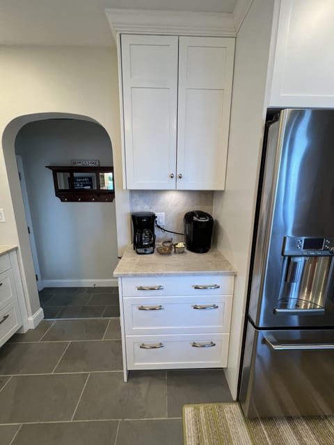 Entry foyer into Kitchen with coffee station.  Keurig and drip coffee pot. 