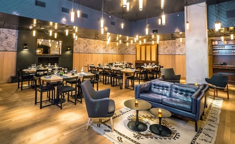 Unwind with cocktails in a stylish lounge and dining space.