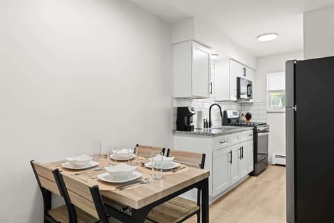 Modern kitchen meets rustic charm—cook, dine, and unwind all in one stylish space.