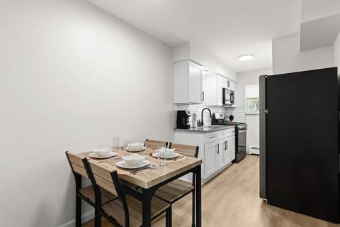 Dine in comfort with a fully equipped modern kitchen just steps away.
